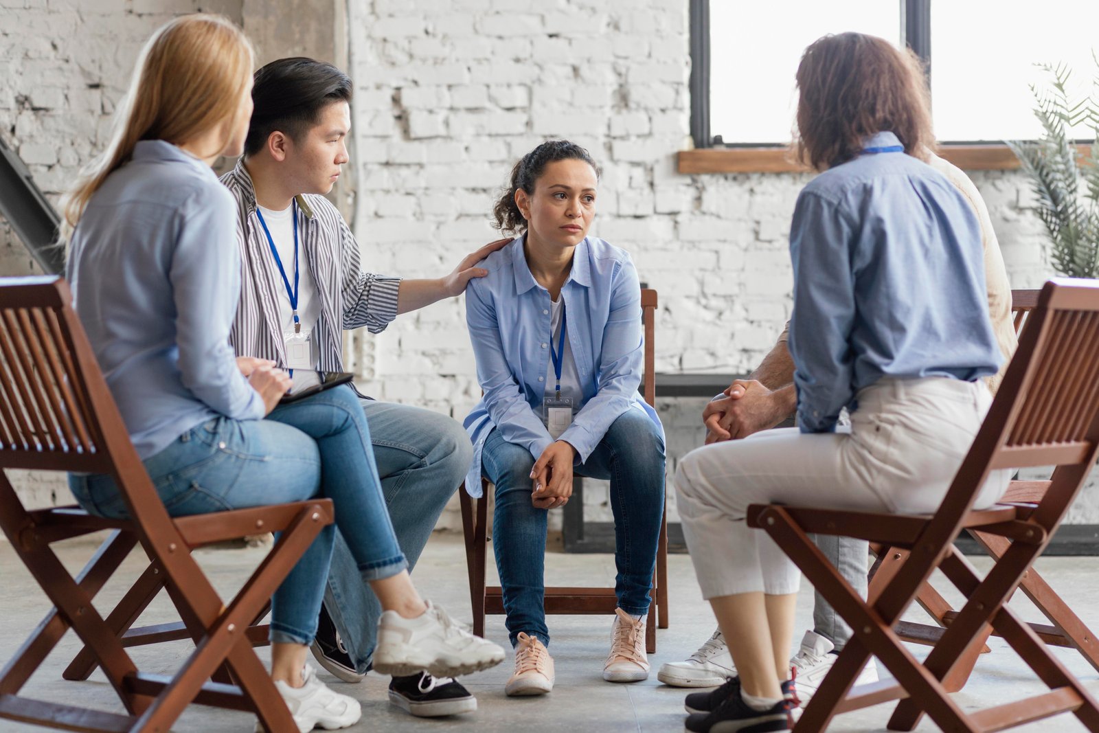 A small group talking together in a warm, comfortable room